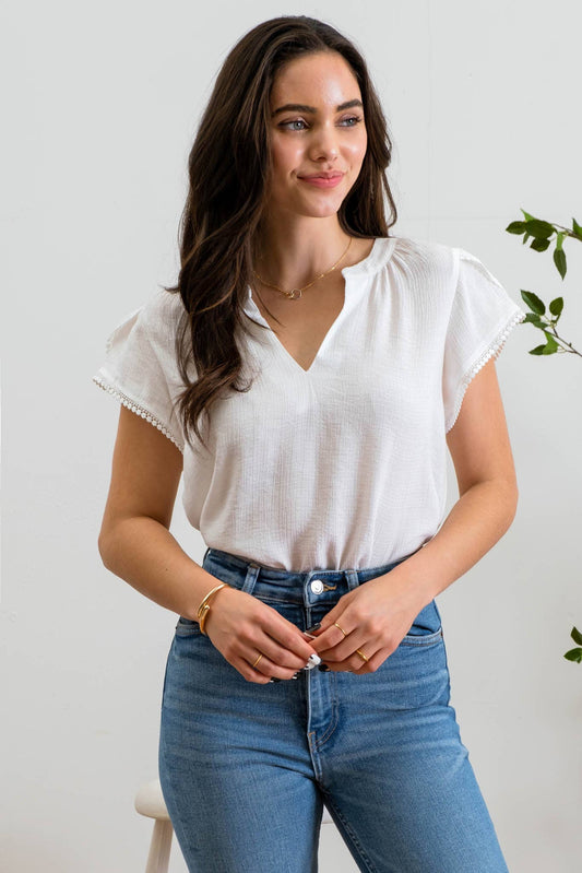 SPLIT NECK PETAL TASSEL SLEEVE BLOUSE: WHITE